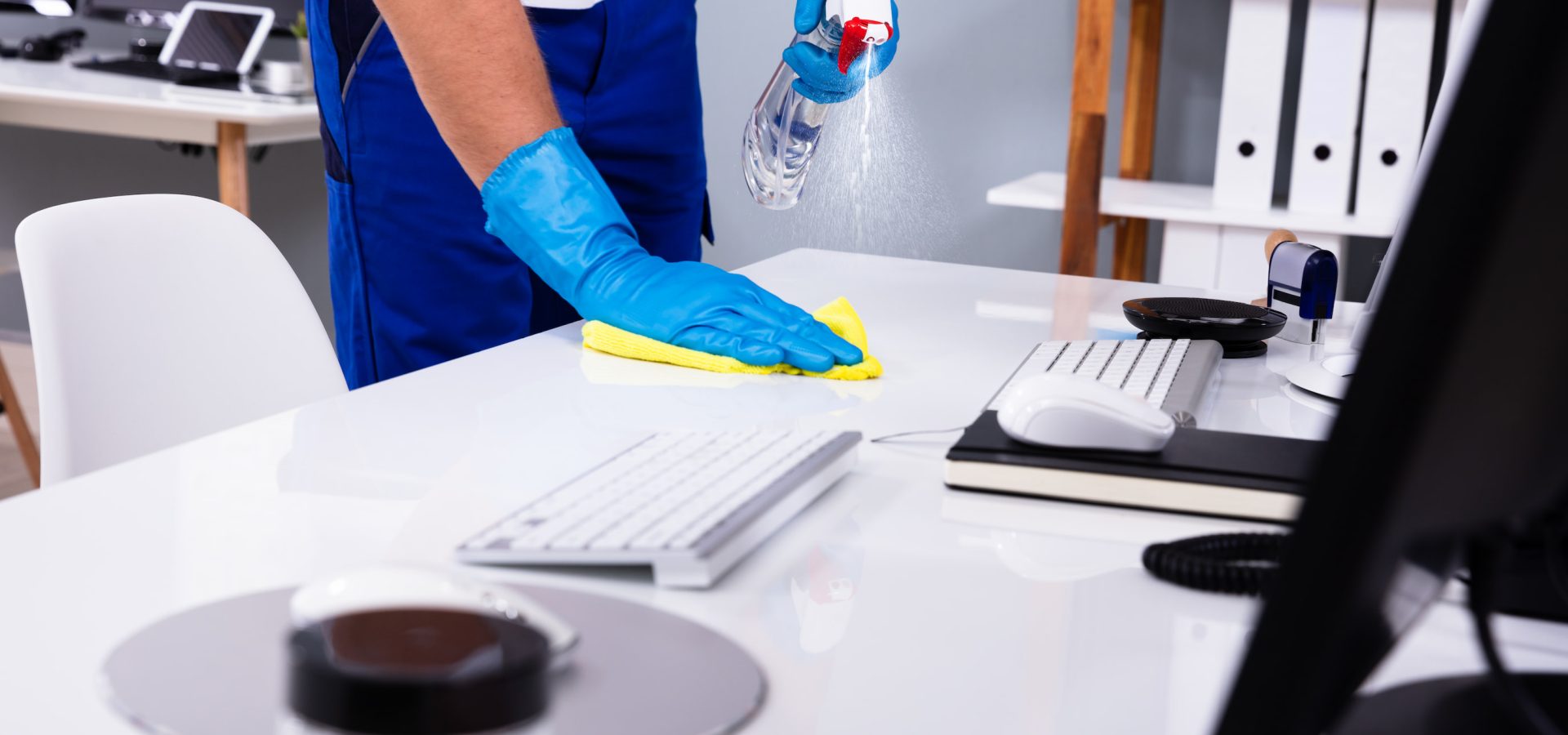 Person cleaning desktop